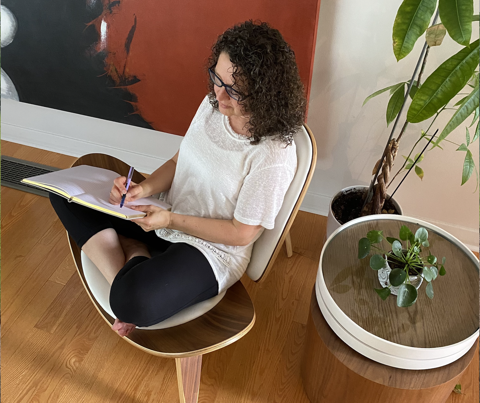 Heidi writing on chair